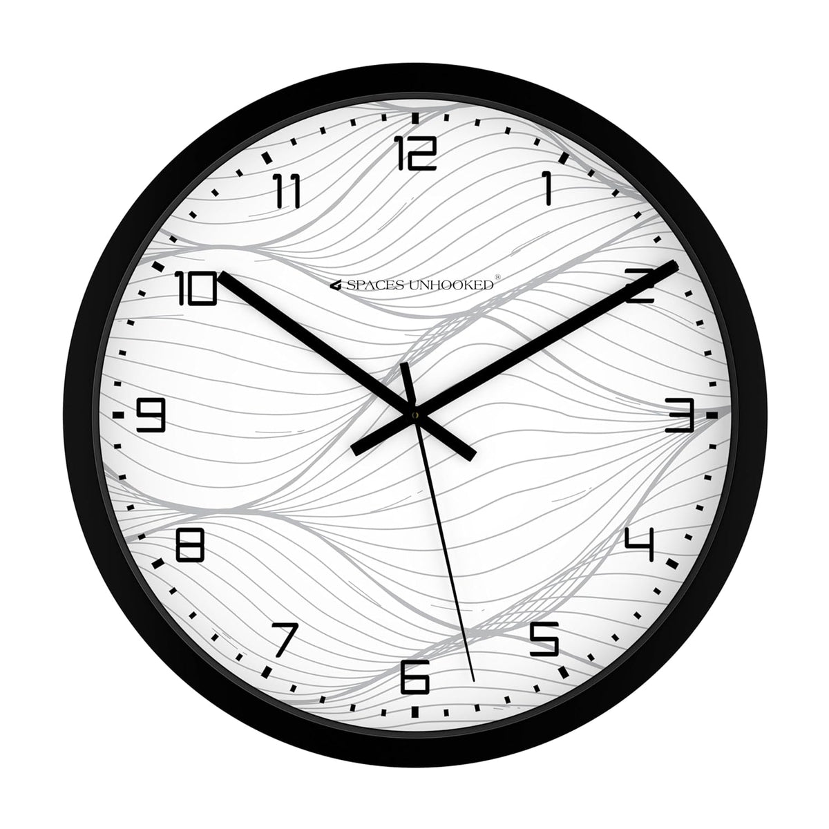 Wall clock with black frame and white face on a white background