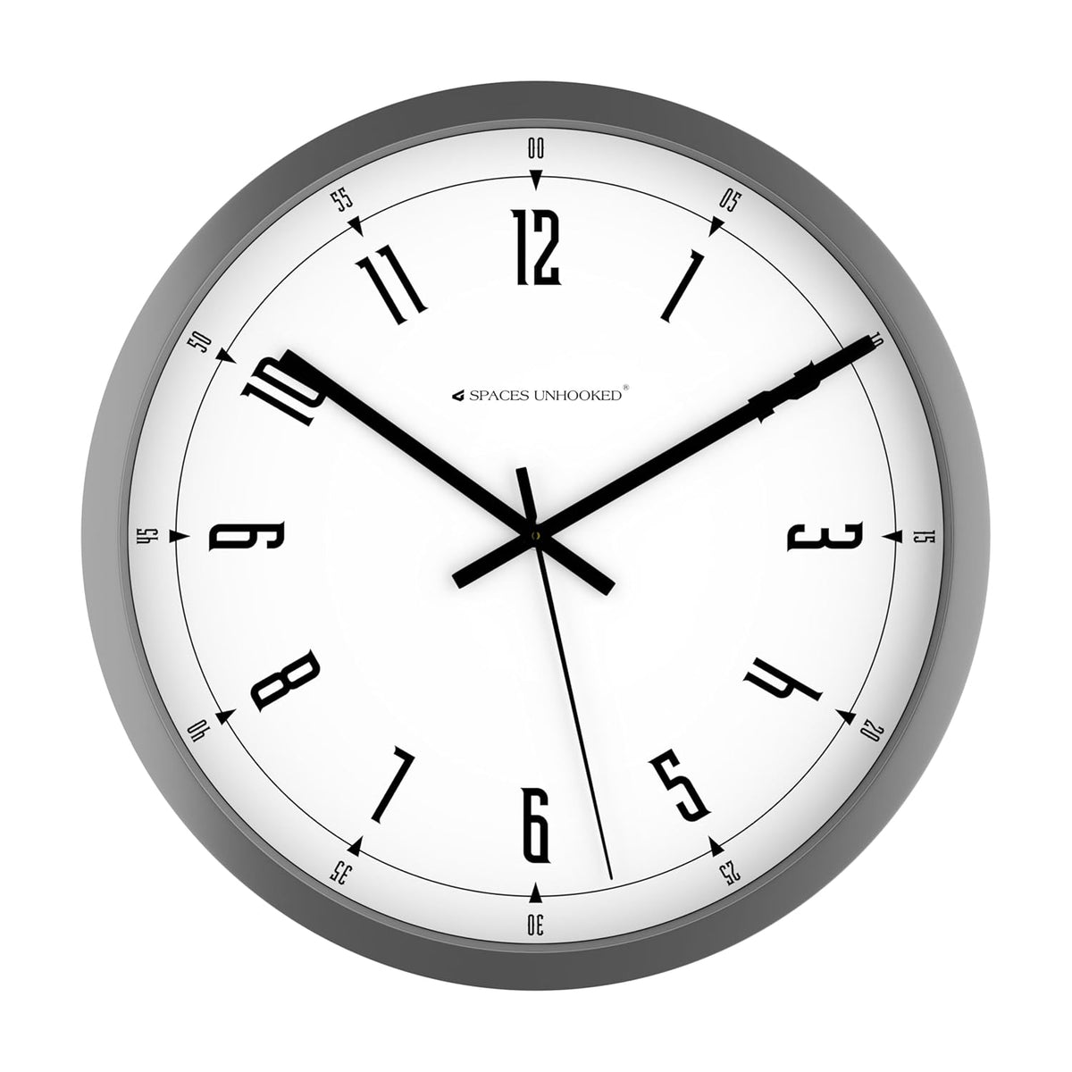Wall clock with black hands and numbers on a white face, branded 'Spaces Unhooked', against a white background.