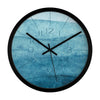 Modern blue abstract wall clock with watercolor design and black frame