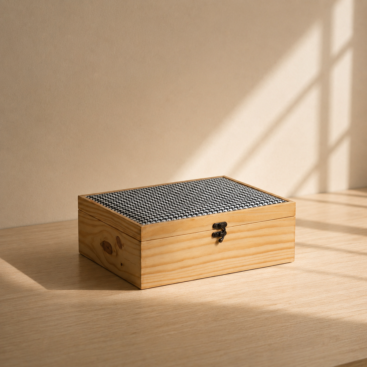 Wooden jewelry box with a textured lid on a wooden surface