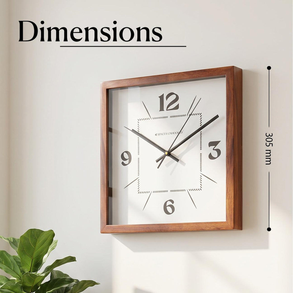 Close-up of bold 12, 3, 6 and 9 numerals on a white dial with a dotted inner square pattern