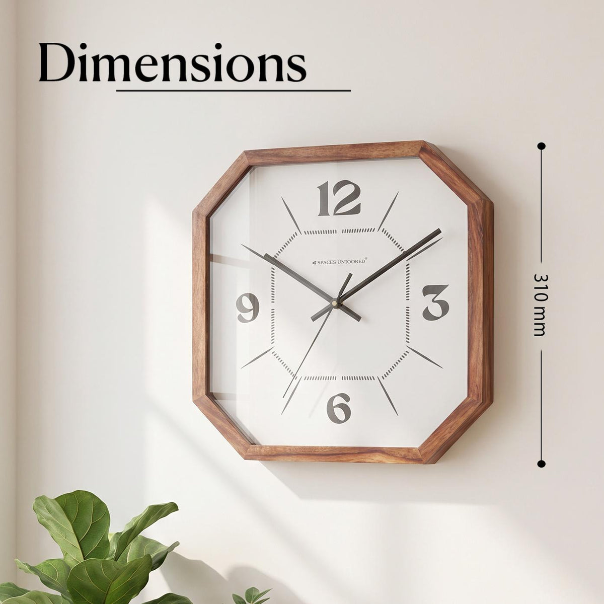 Close-up of bold 12, 3, 6 and 9 numerals on a white dial with a dotted inner octagon pattern