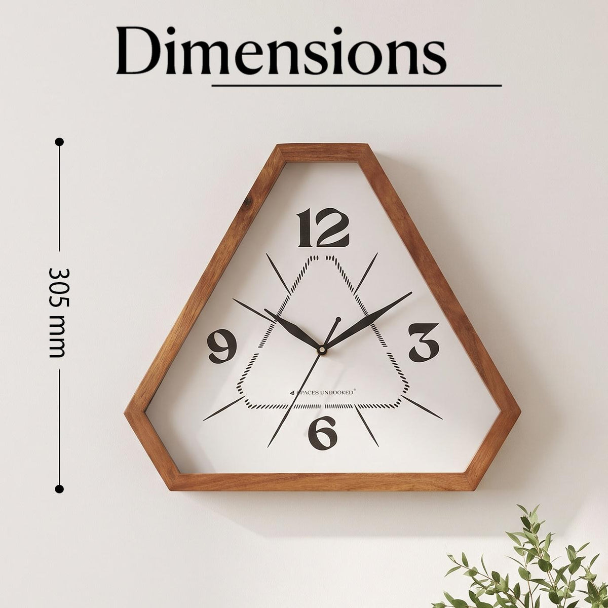 Close-up of bold 12, 3, 6 and 9 numerals on a white dial with a dotted inner triangle pattern