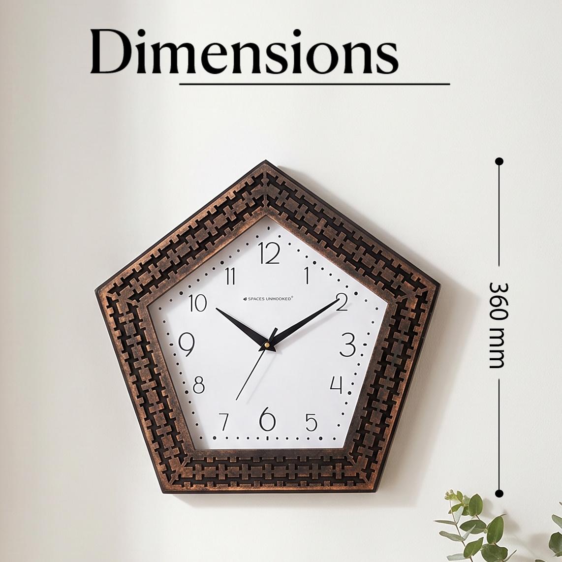 Pentagon copper weave wall clock on a hallway wall above a console