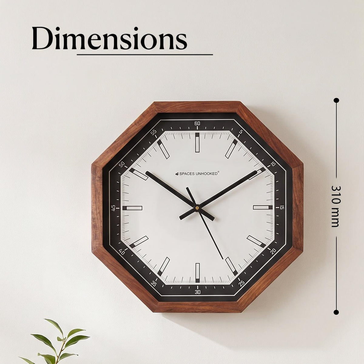 Close-up of the black bezel with white minute scale numbered 5 to 60 on an octagonal wall clock