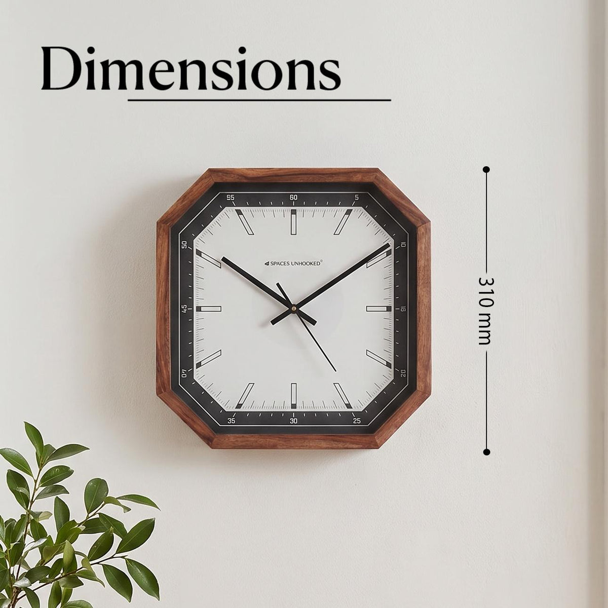 Close-up of the black bezel with white minute scale numbered 5 to 60 on a cut-corner wall clock
