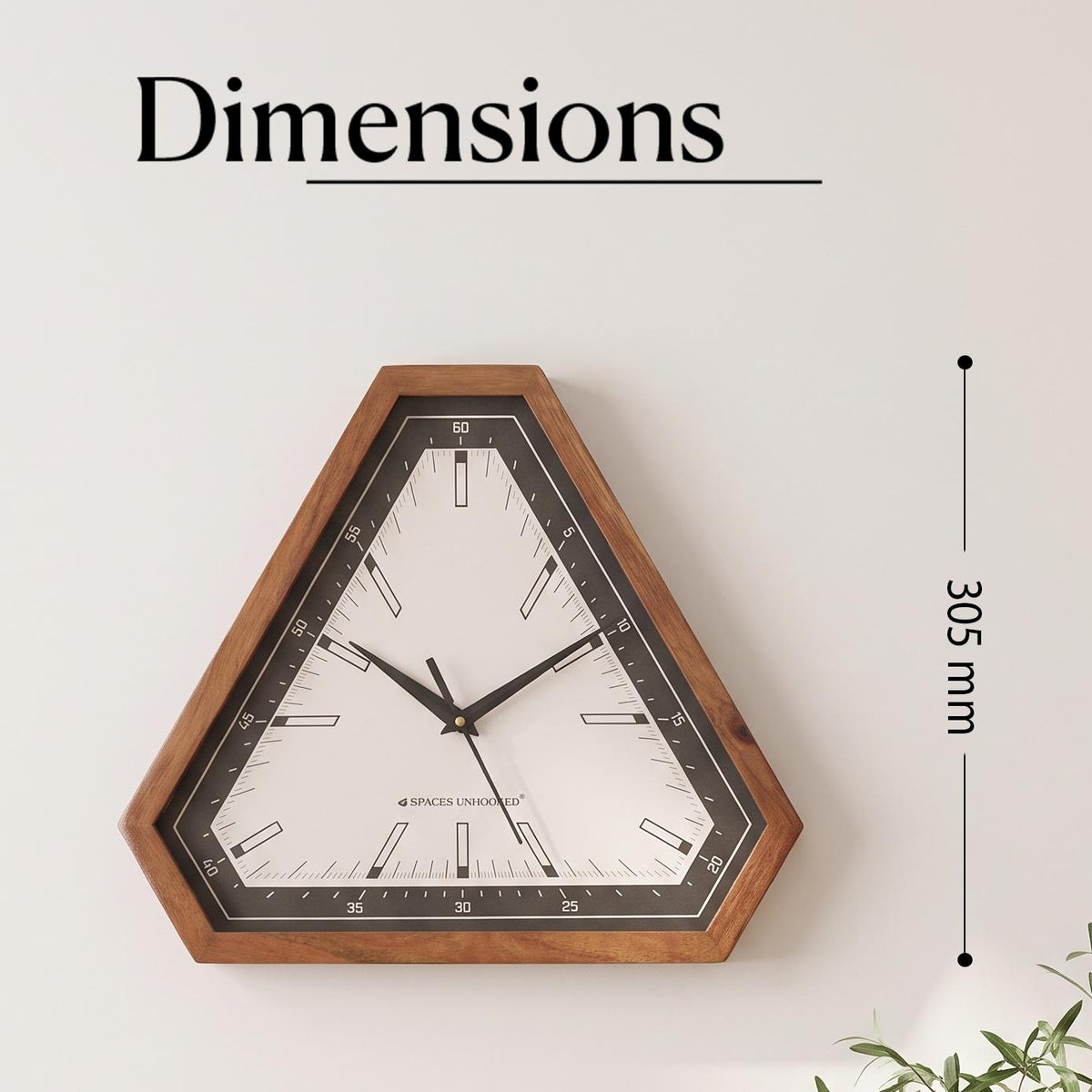 Close-up of the black bezel with white minute scale numbered 5 to 60 on a triangular wall clock