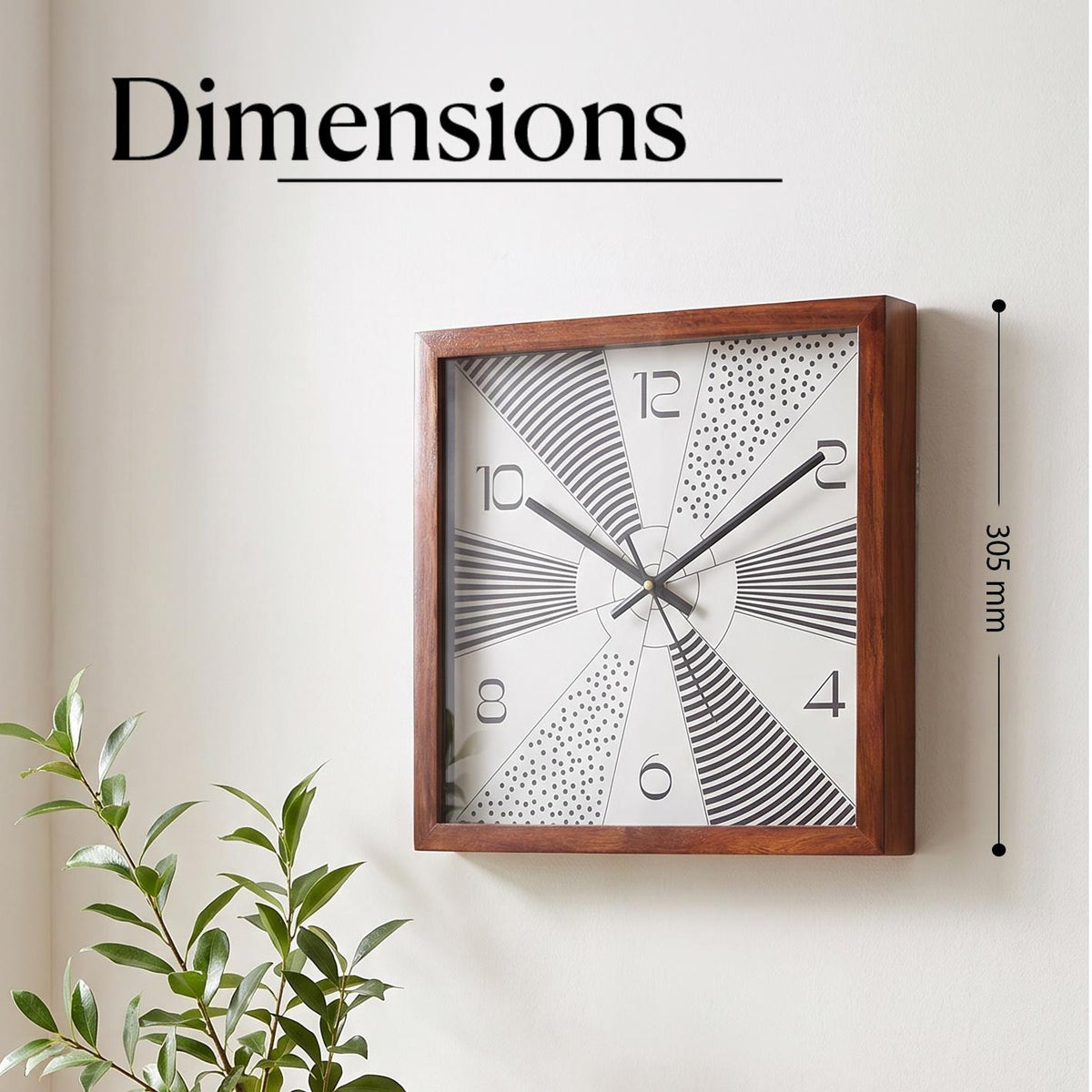Close-up of sunburst wedges filled with black stripes and dots on a white clock dial