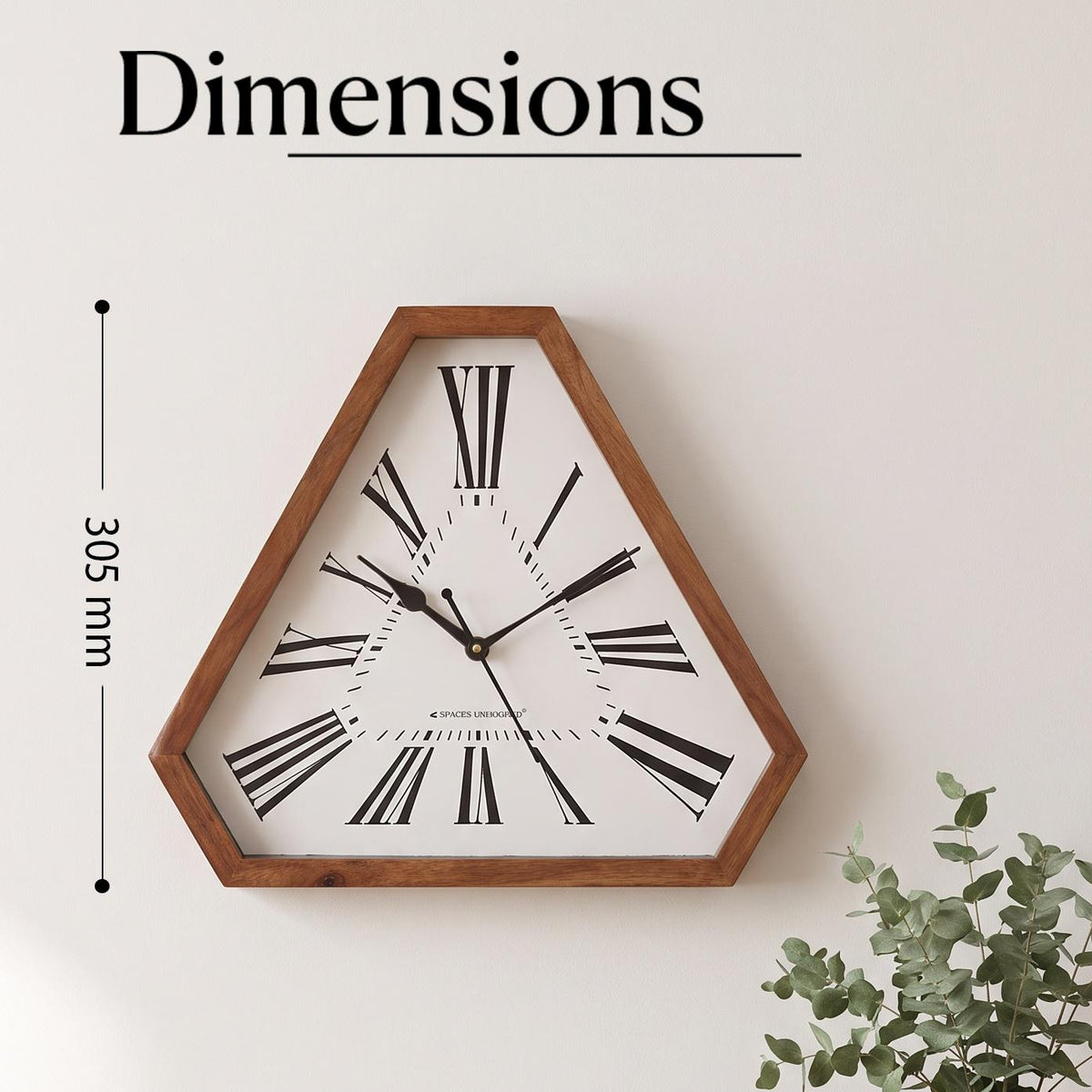 Close-up of oversized black Roman numerals fanning across a triangular clock dial
