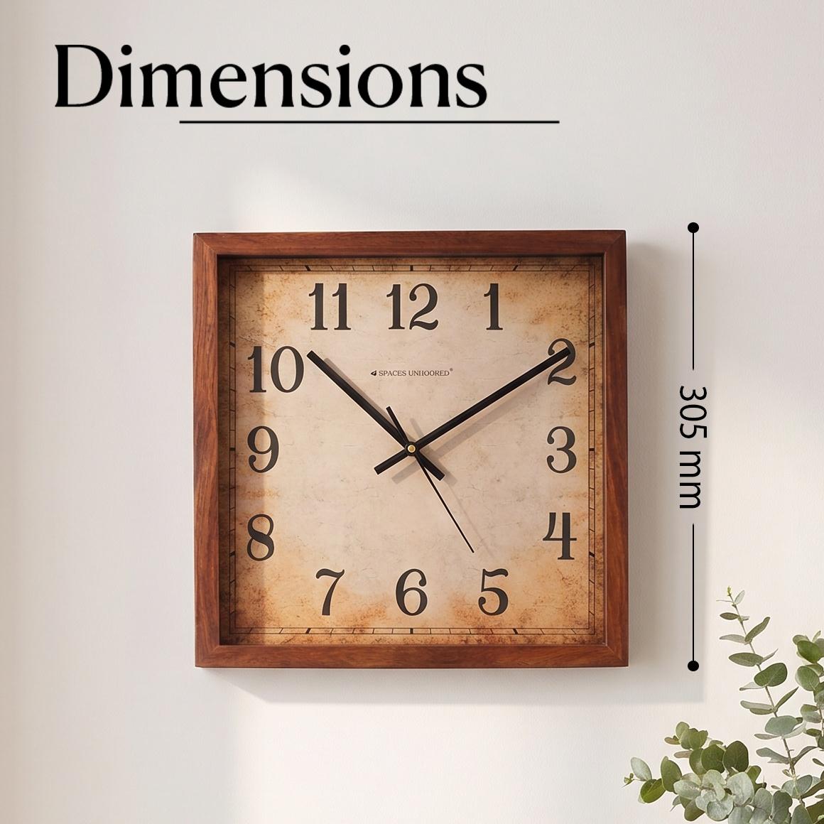 Close-up of aged parchment-style dial with crackle texture on a vintage square wall clock
