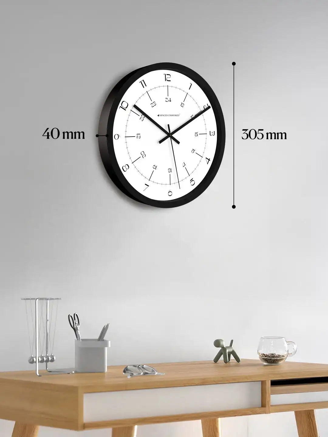 Dimensions of Spaces Unhooked 12 inch black wall clock showing 305 mm diameter and 40 mm depth