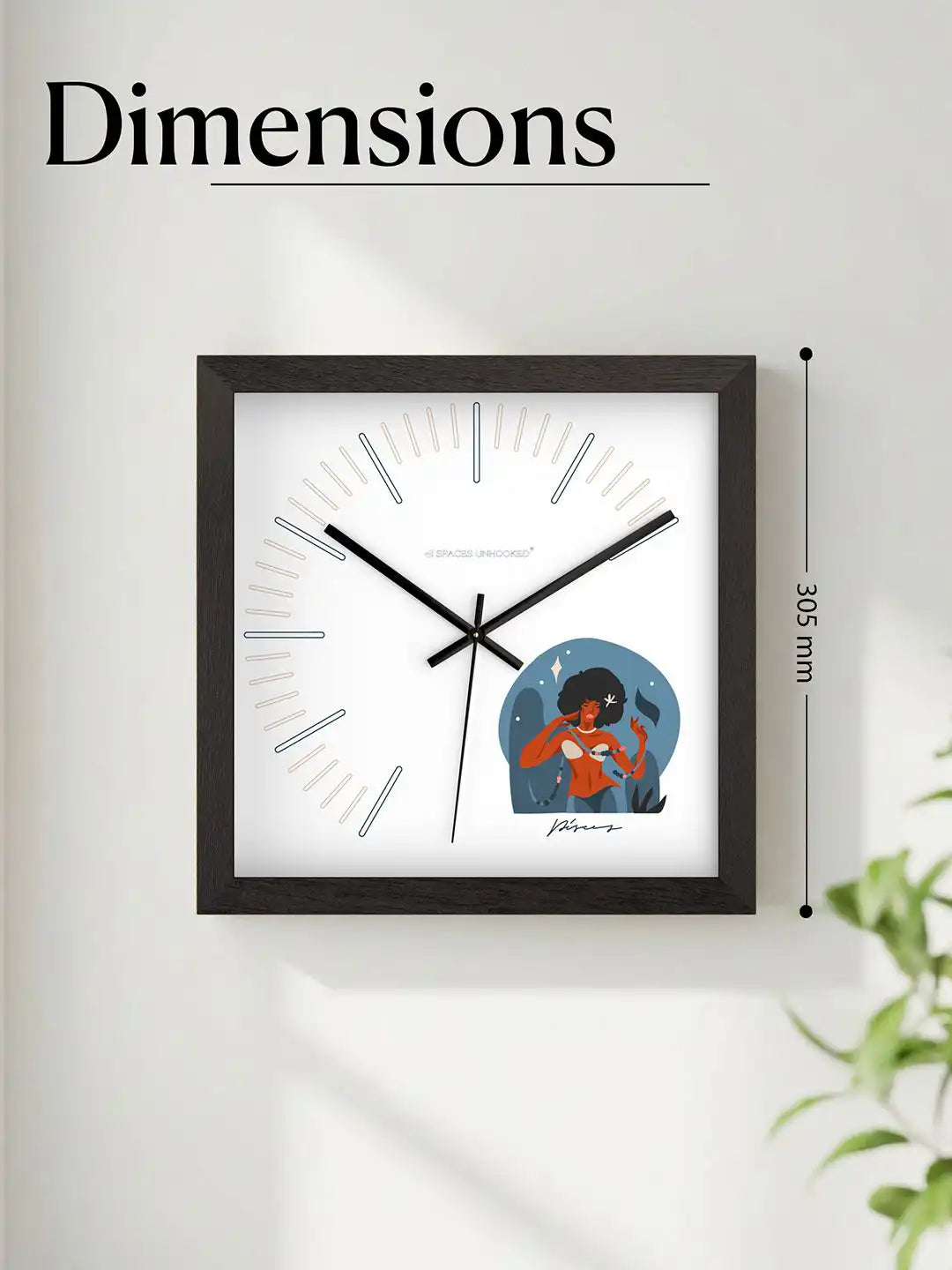 Modern black-framed wall clock mounted on a wall, complementing elegant home décor and furnishings.
