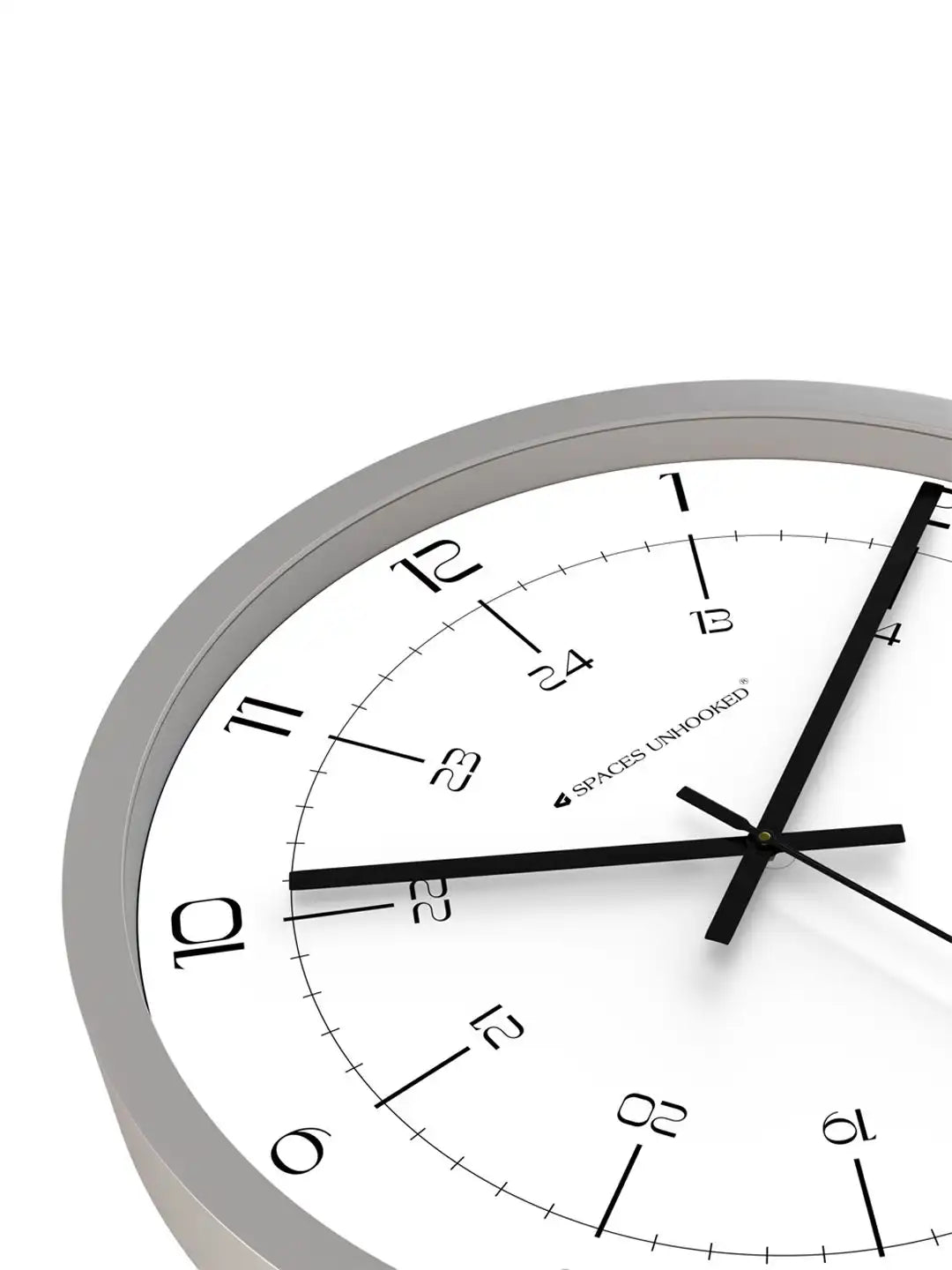 Close-up angled front view of Spaces Unhooked grey wall clock with dual 12 and 24 hour dial