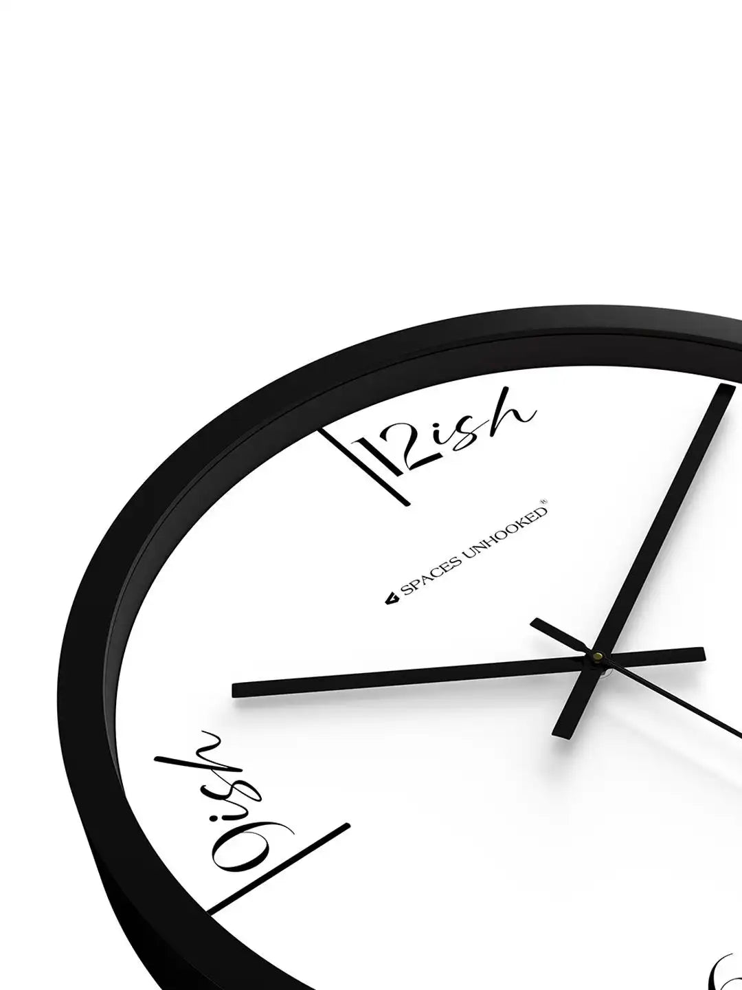 Angled front view of Spaces Unhooked black wall clock with white dial and artistic handwritten numerals