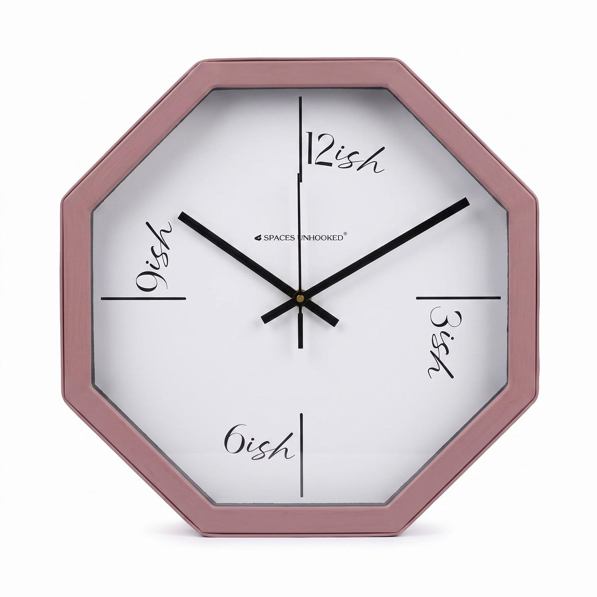 Dusty rose octagonal wall clock in a soft bedroom with white bedding and brass details