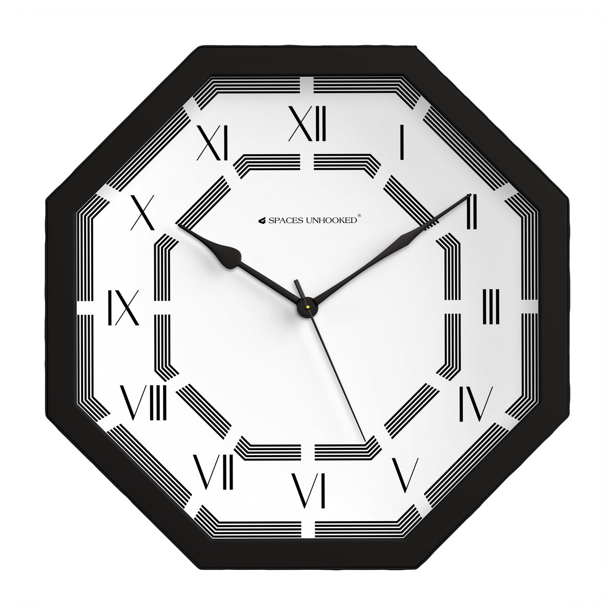 Black octagonal clock with Roman numerals on a wall in a quiet home study