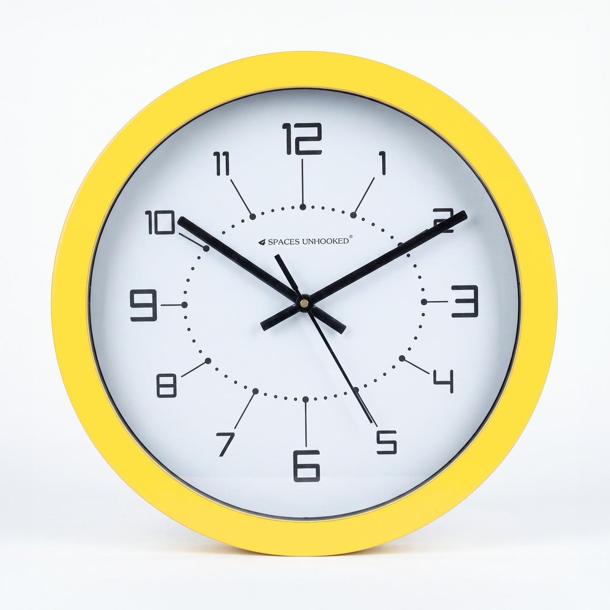 Sunshine yellow round wall clock in a kitchen breakfast nook with light wood furniture
