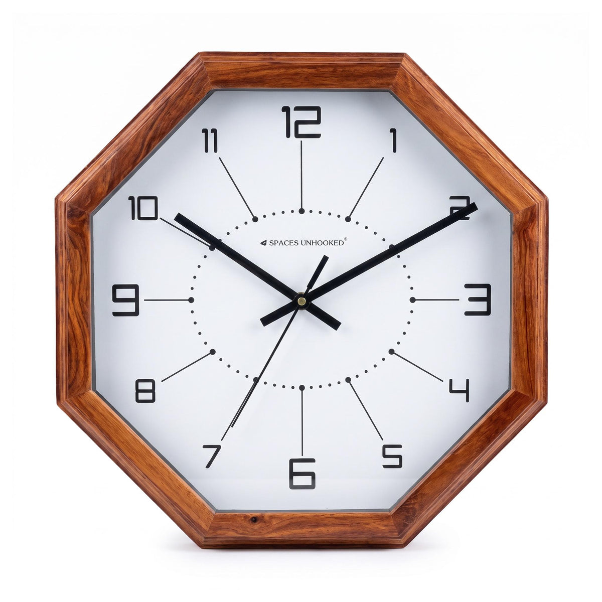 Dotted ring octagon wall clock on a living room wall above a sofa