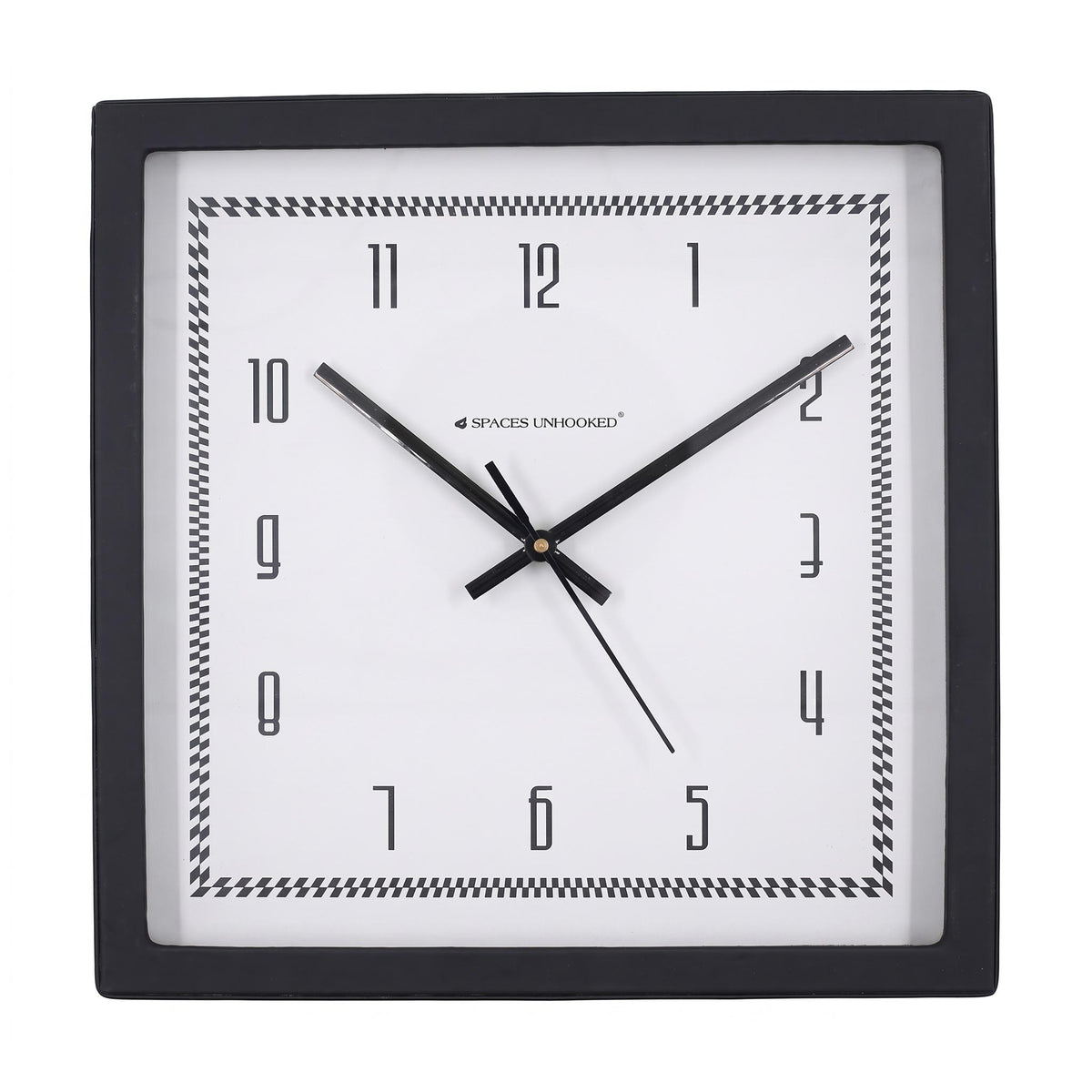 Checked border wall clock on a desk in a home office