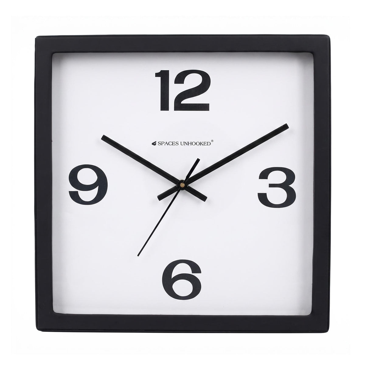 Bold 12-3-6-9 wall clock on a desk in a tidy home office
