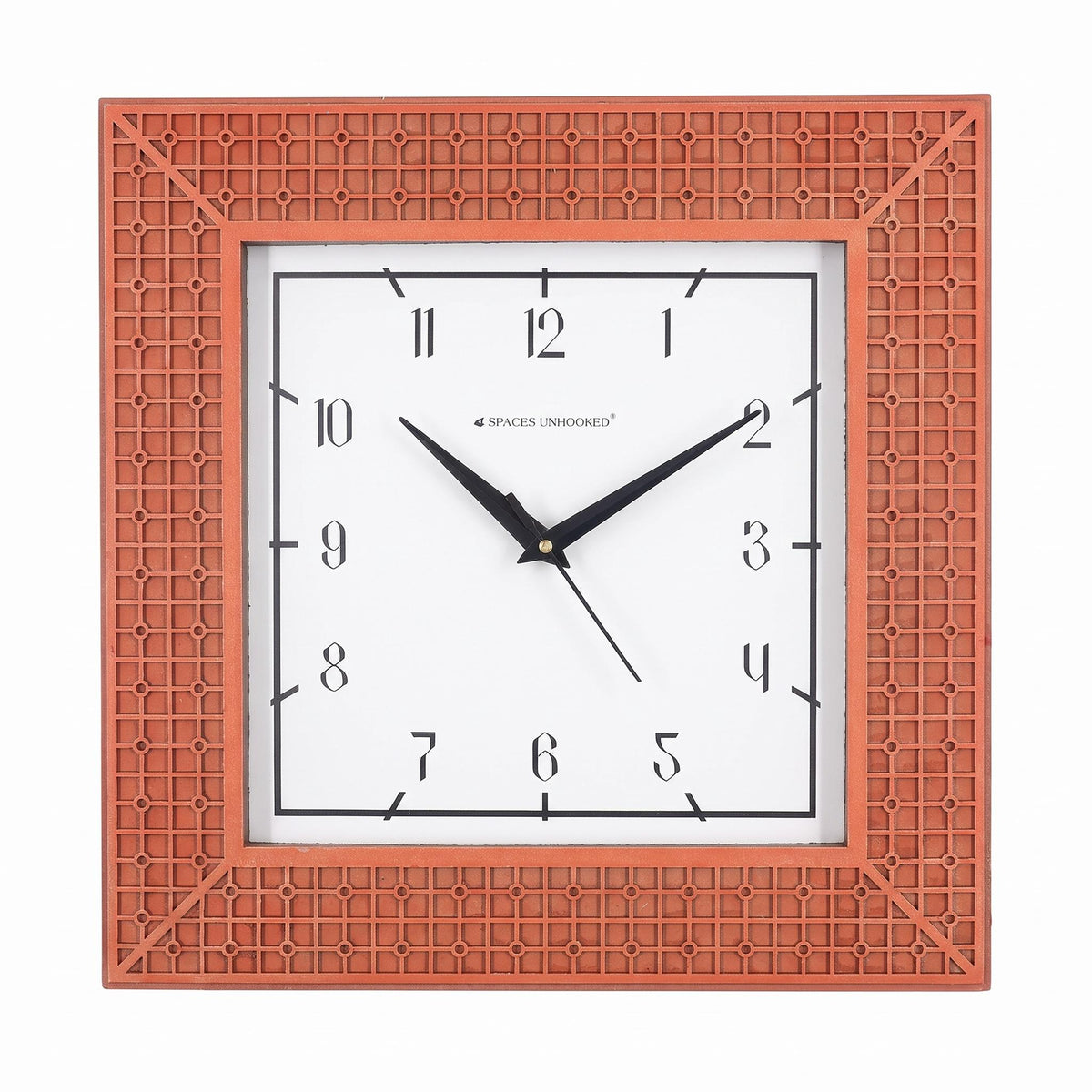 Terracotta lattice wall clock on a living room wall above a sofa
