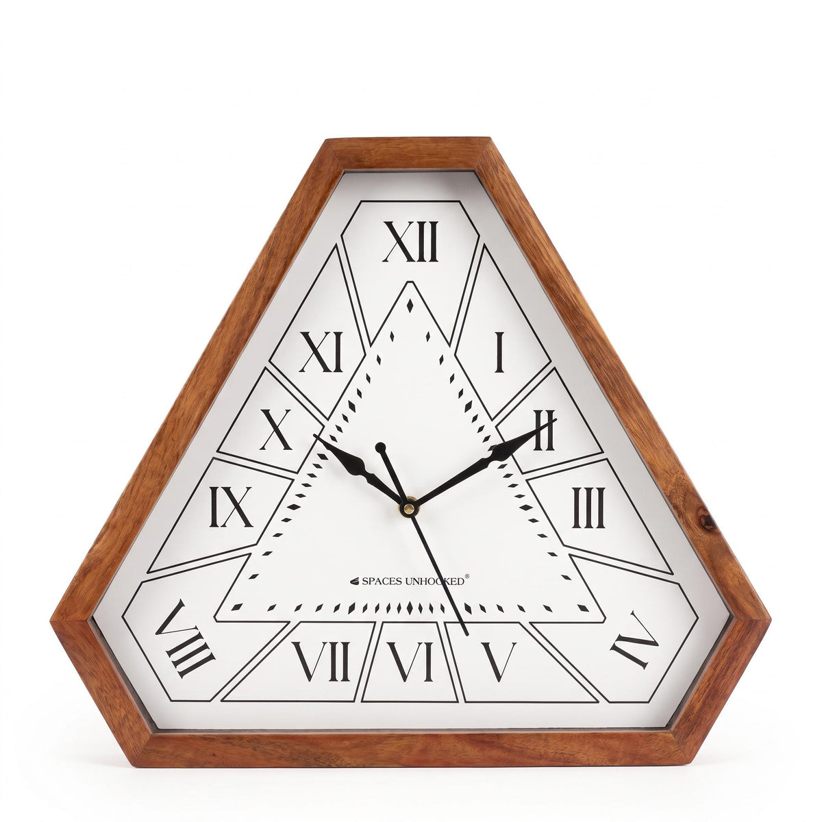 Triangular wooden wall clock with Roman numerals on a quiet study wall beside a tall bookshelf