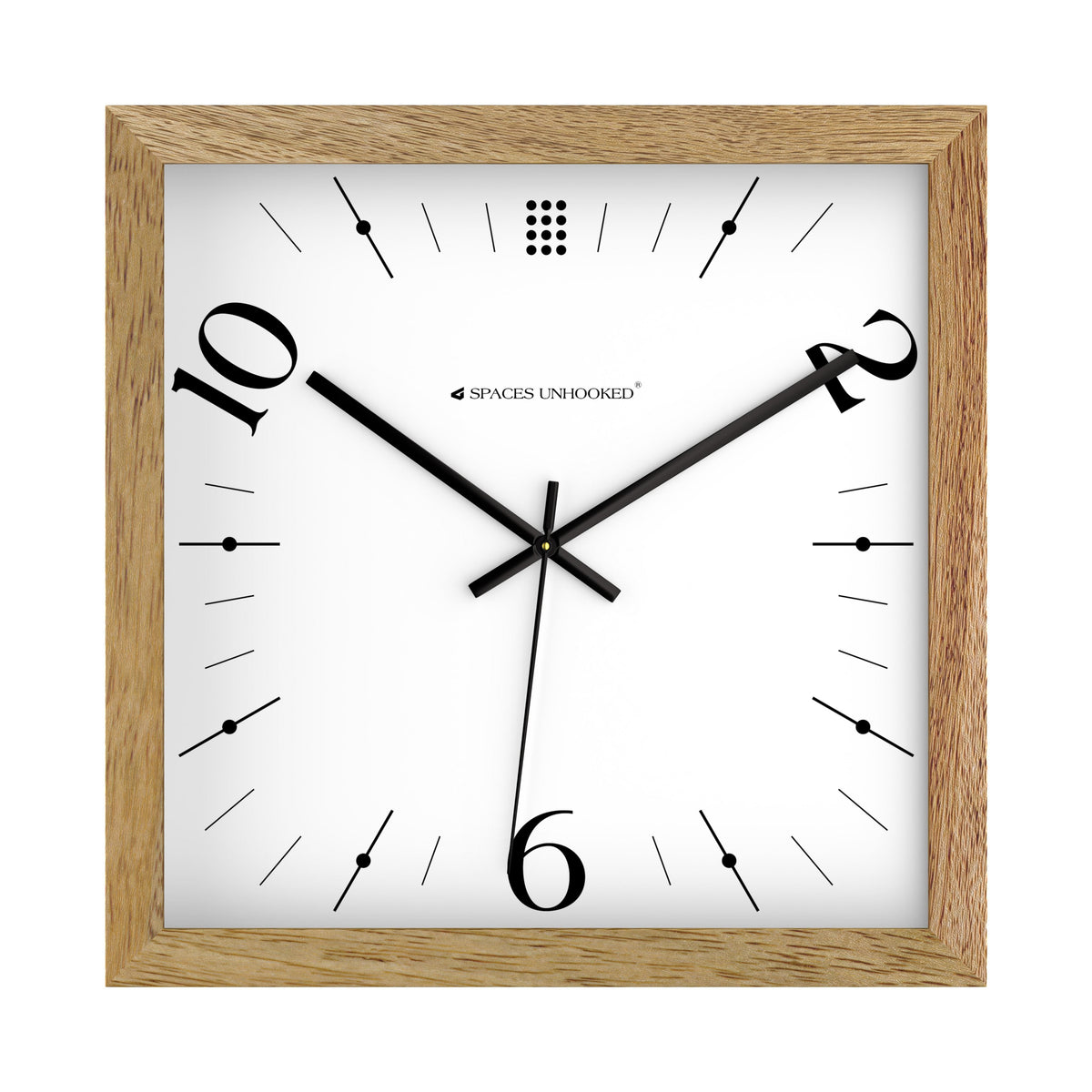 Light oak square wooden wall clock above a desk in a creative office with black frames
