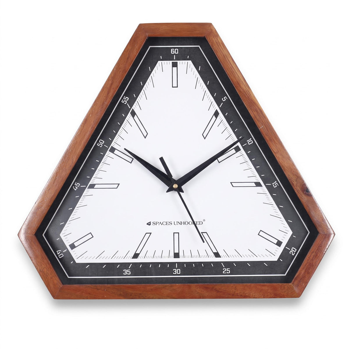 Modern triangular wooden wall clock with black and white dial on a grey living room wall