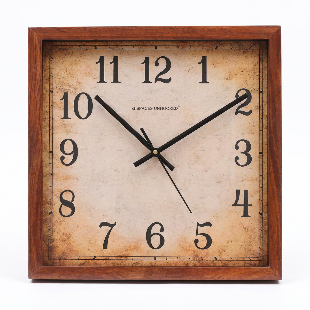 Vintage wall clock with antique dial in a study with bookshelves and brass decor