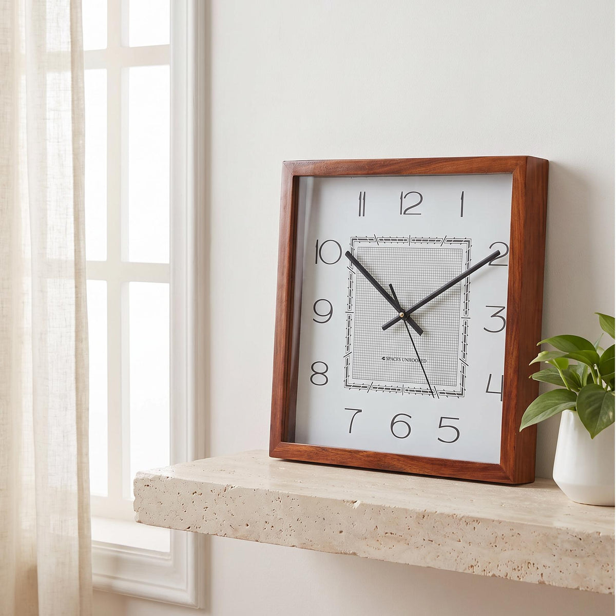 Spaces Unhooked art deco square wooden wall clock with fine grid dial, front view