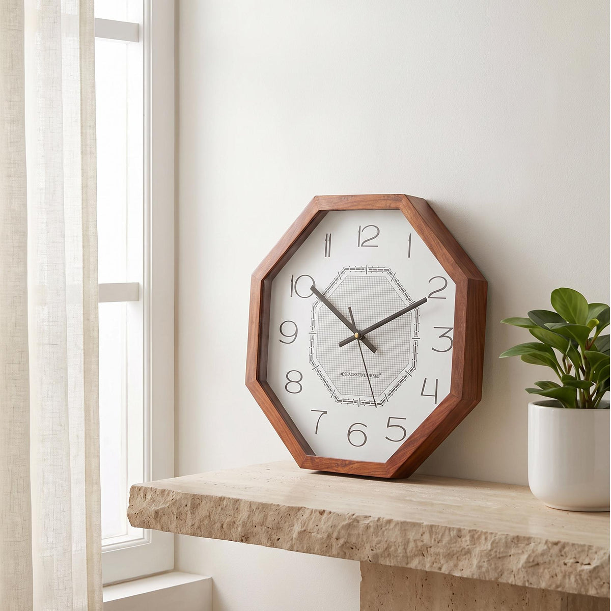 Spaces Unhooked art deco octagonal wooden wall clock with fine grid dial, front view