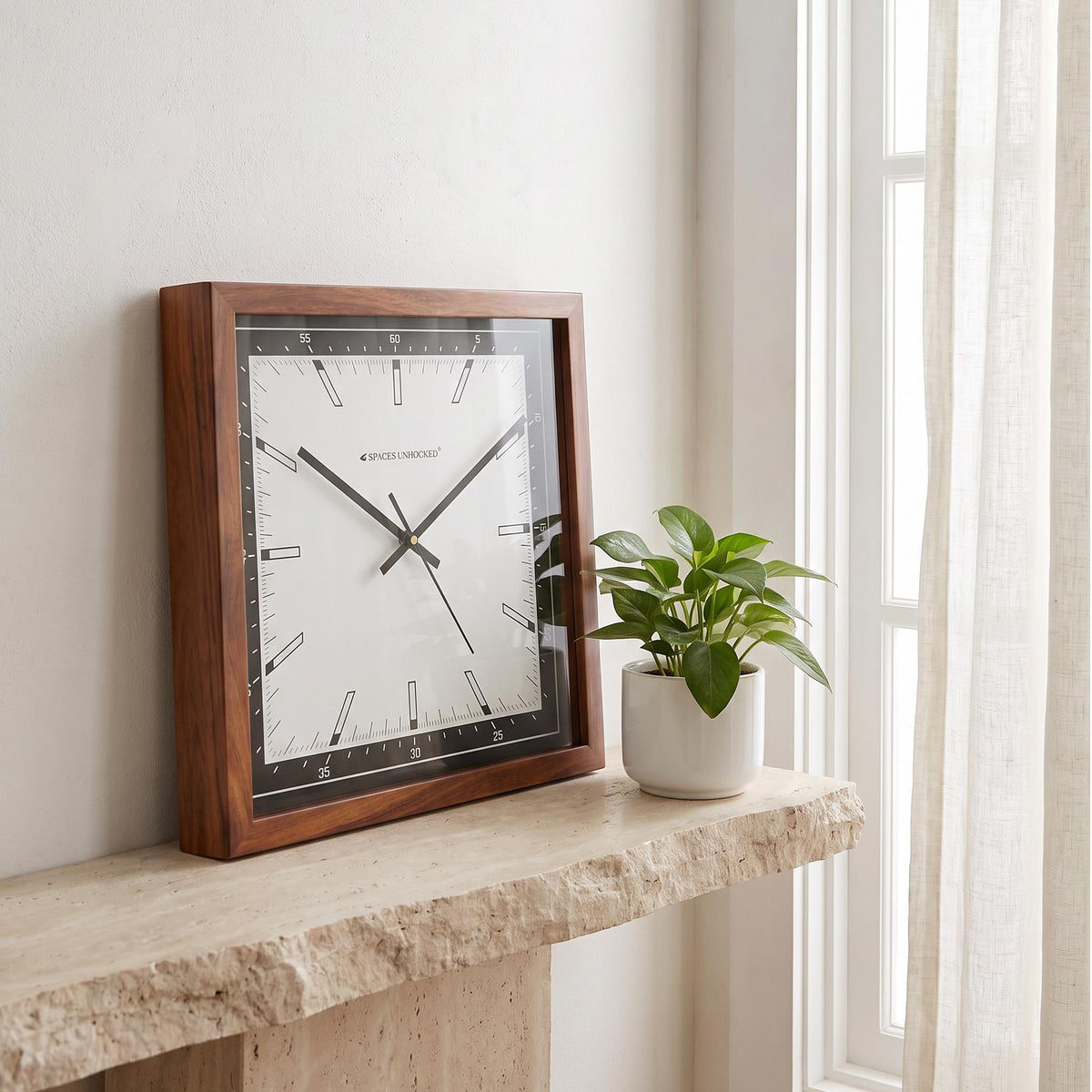 Spaces Unhooked modern square wooden wall clock with black bezel and white dial, front view