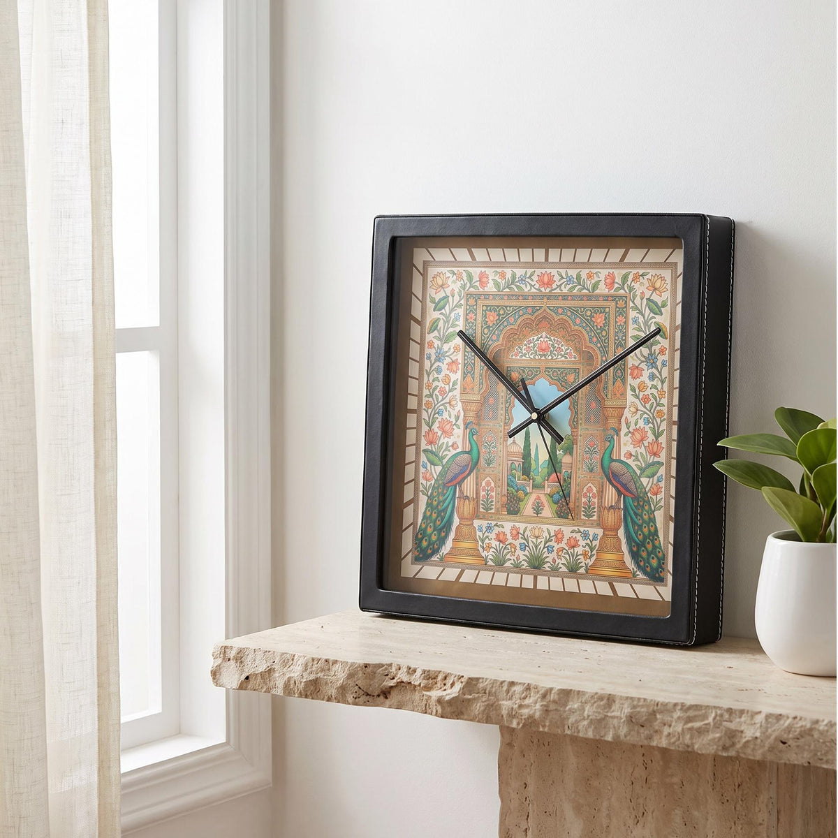 Square black wall clock with painted peacocks and florals on the dial, front view