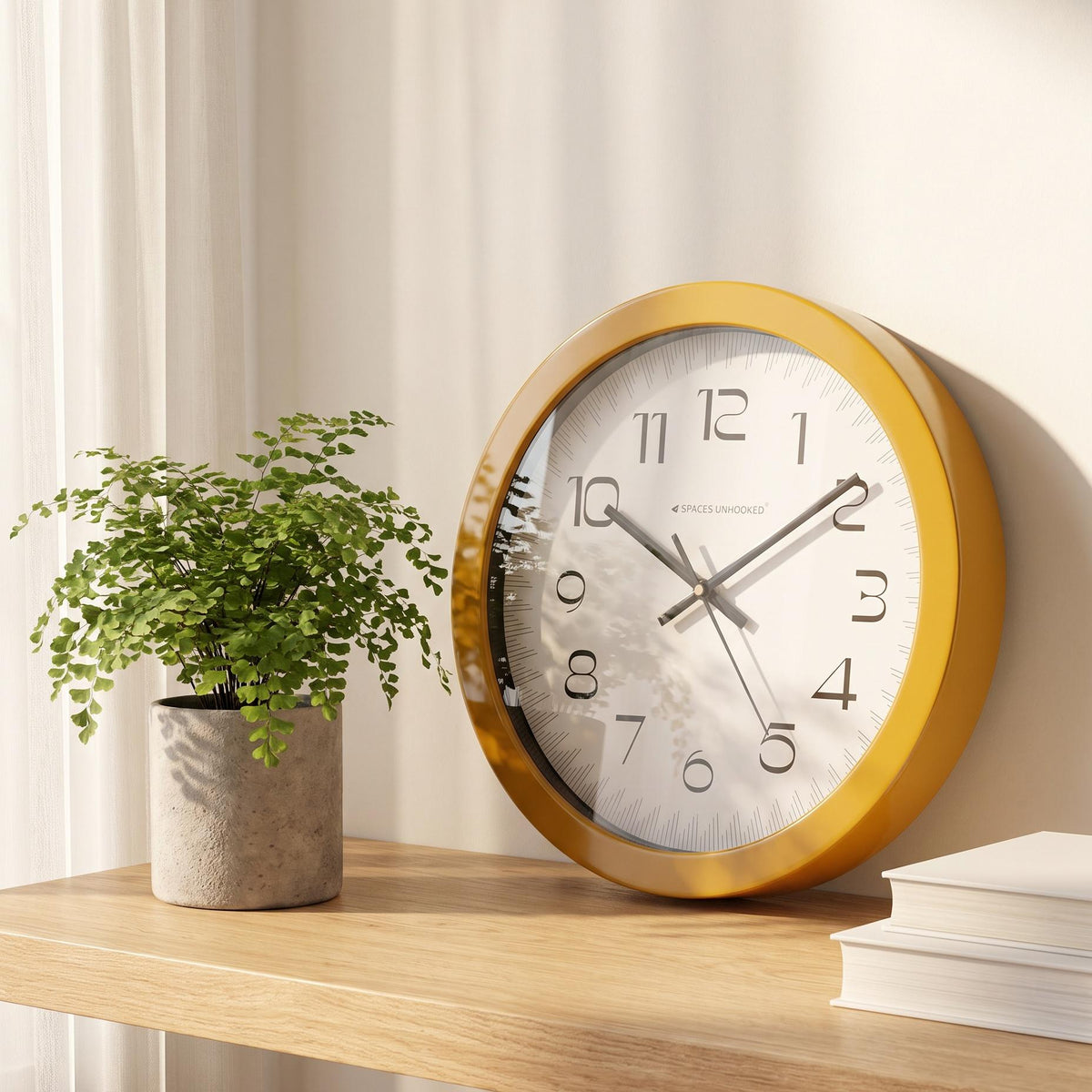 Spaces Unhooked mustard yellow round wall clock with ruler style dial, front view