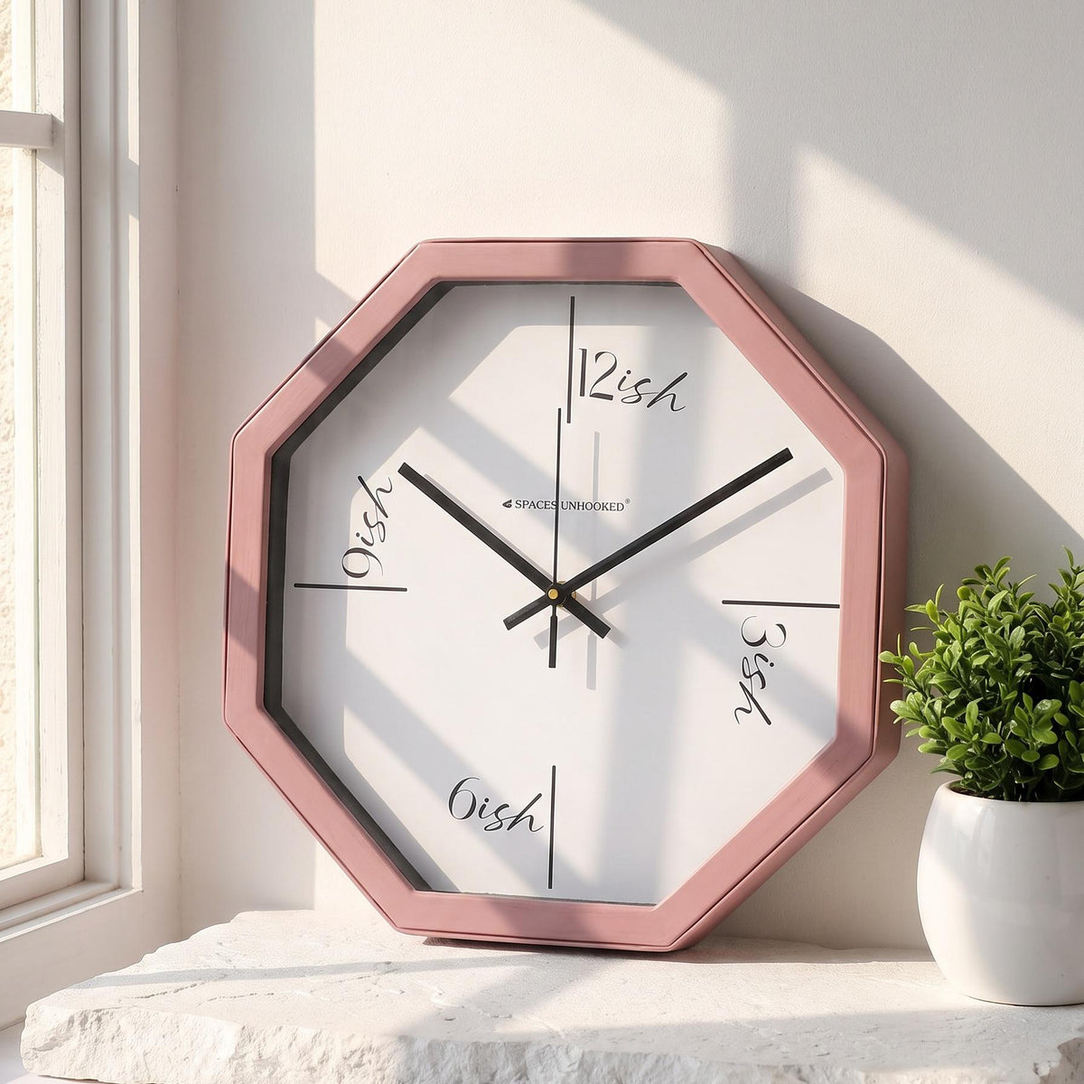 Spaces Unhooked dusty rose octagonal wall clock with ish time script dial, front view