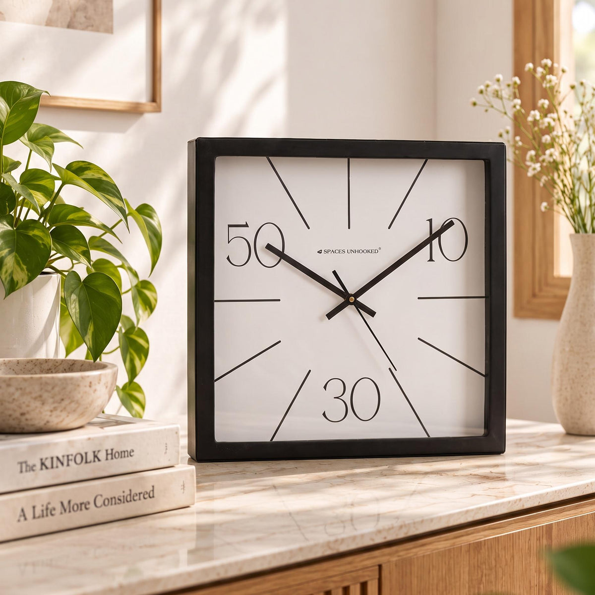 Radial line wall clock on a bedroom wall above a dresser