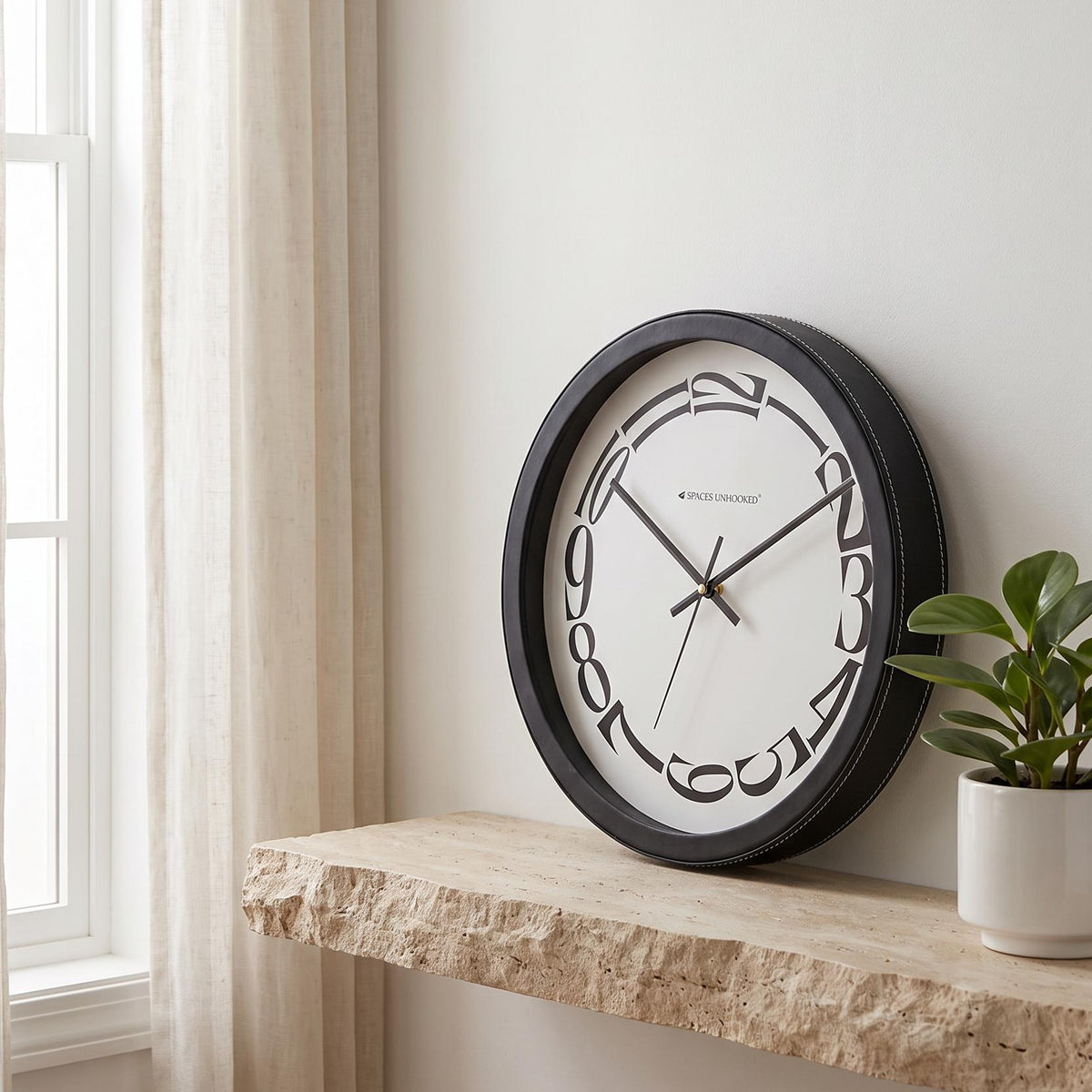 Spaces Unhooked Round Wall Clock, Melting Warped Numerals, Black Frame