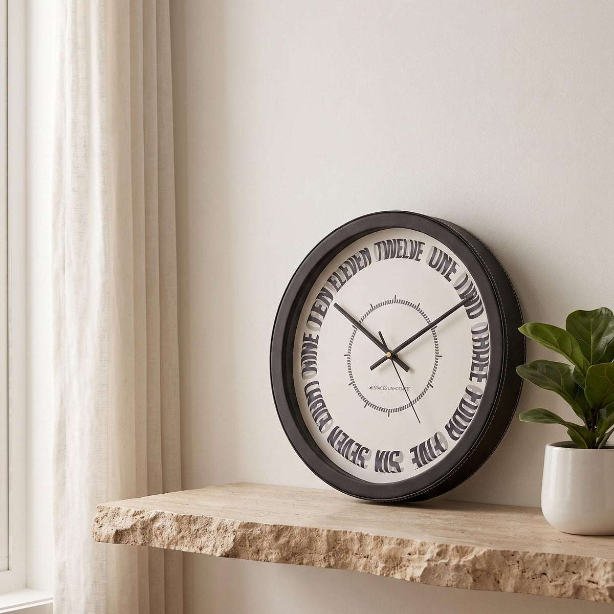 Spaces Unhooked Round Wall Clock, Curved Number Words, Black Frame