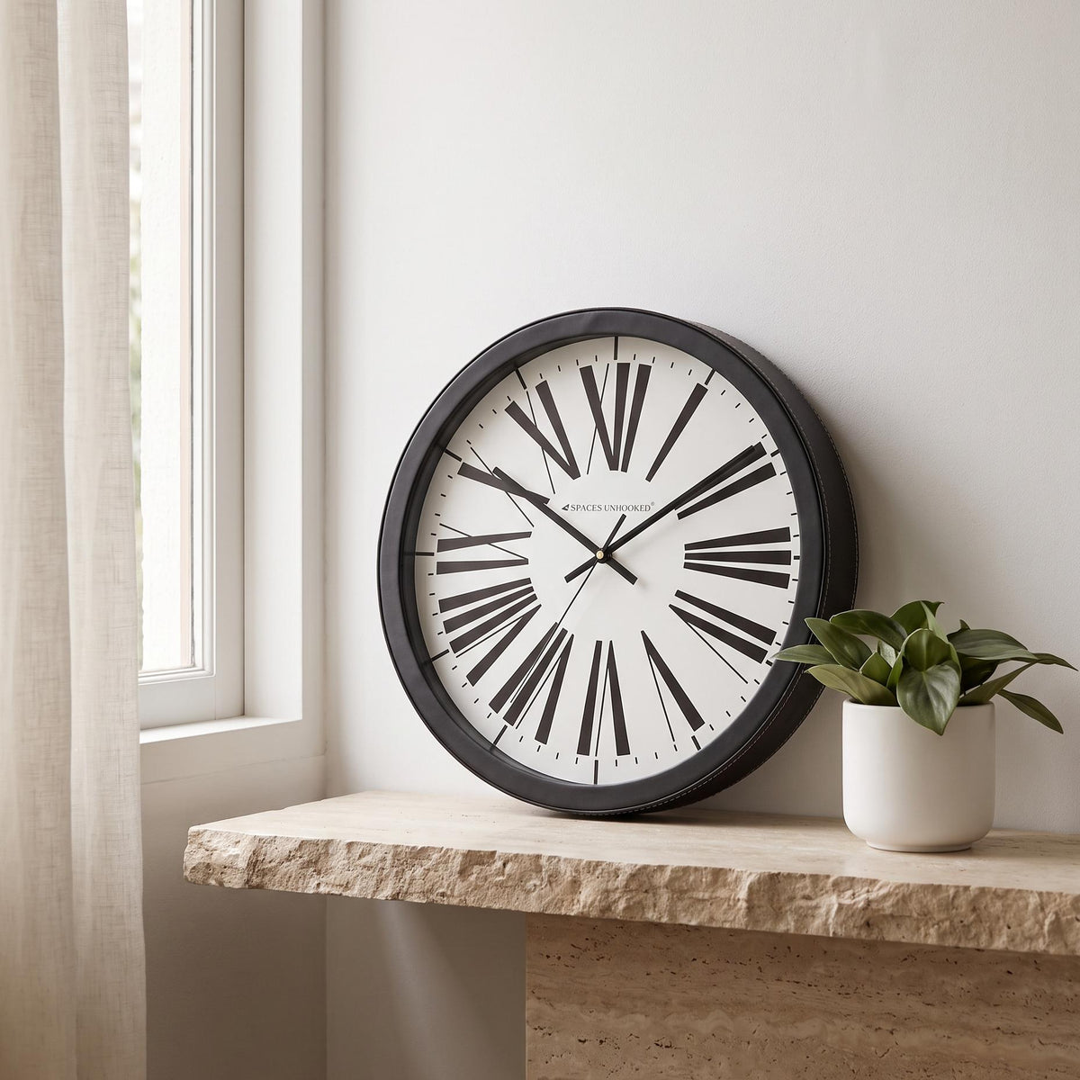 Spaces Unhooked Round Wall Clock, Tapered Roman Numerals, Black Frame