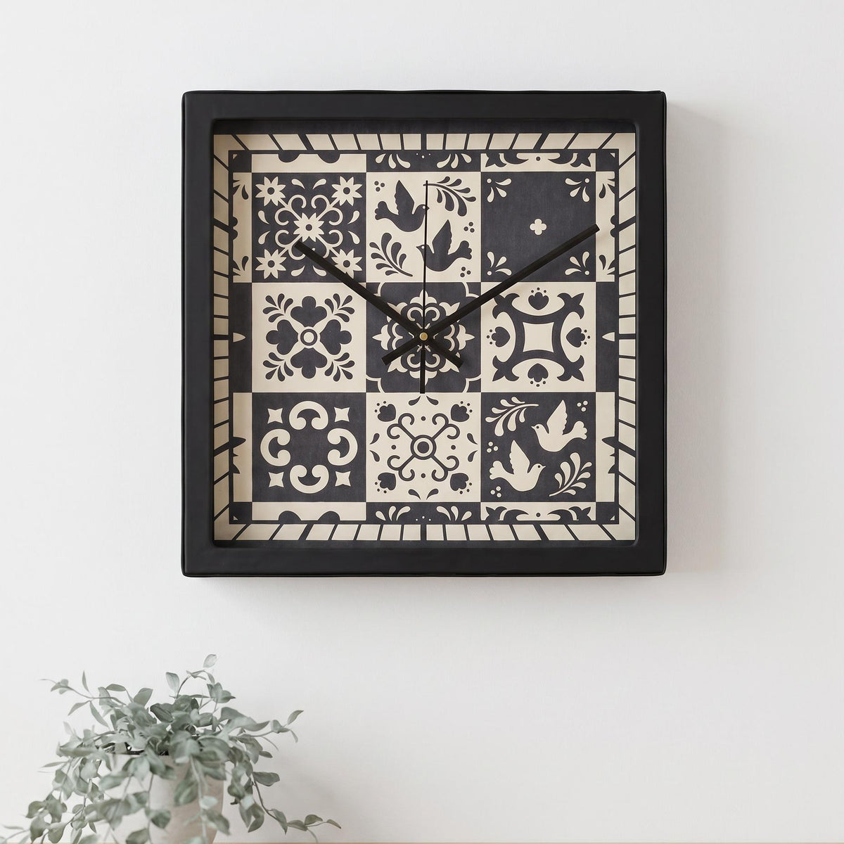 Folk art tile wall clock on a hallway beside a framed print
