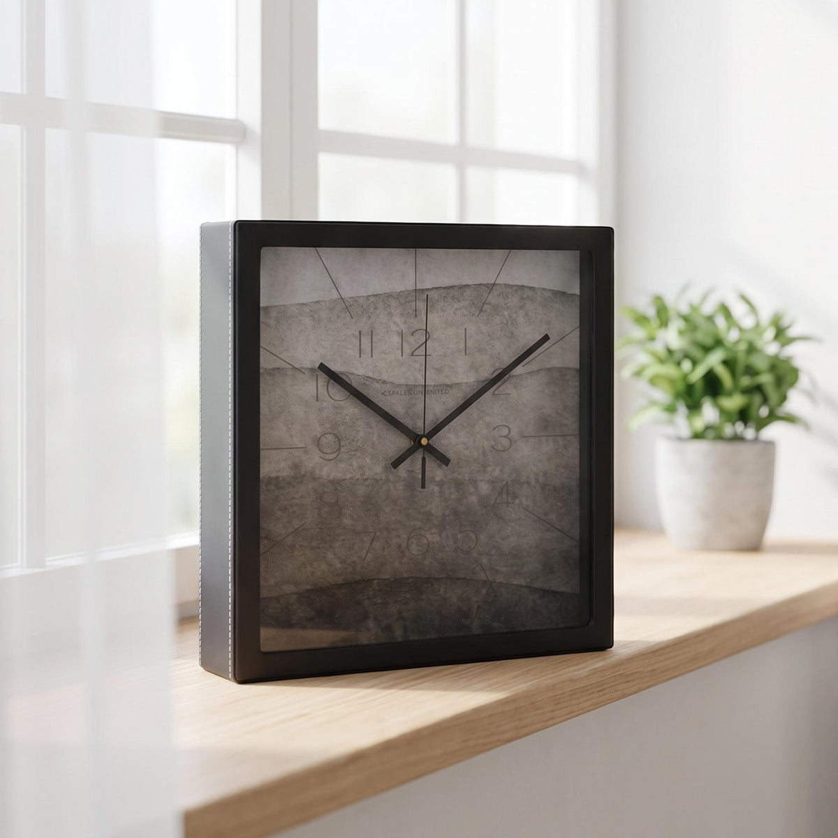 Ash grey watercolour wall clock on a hallway wall beside a mirror