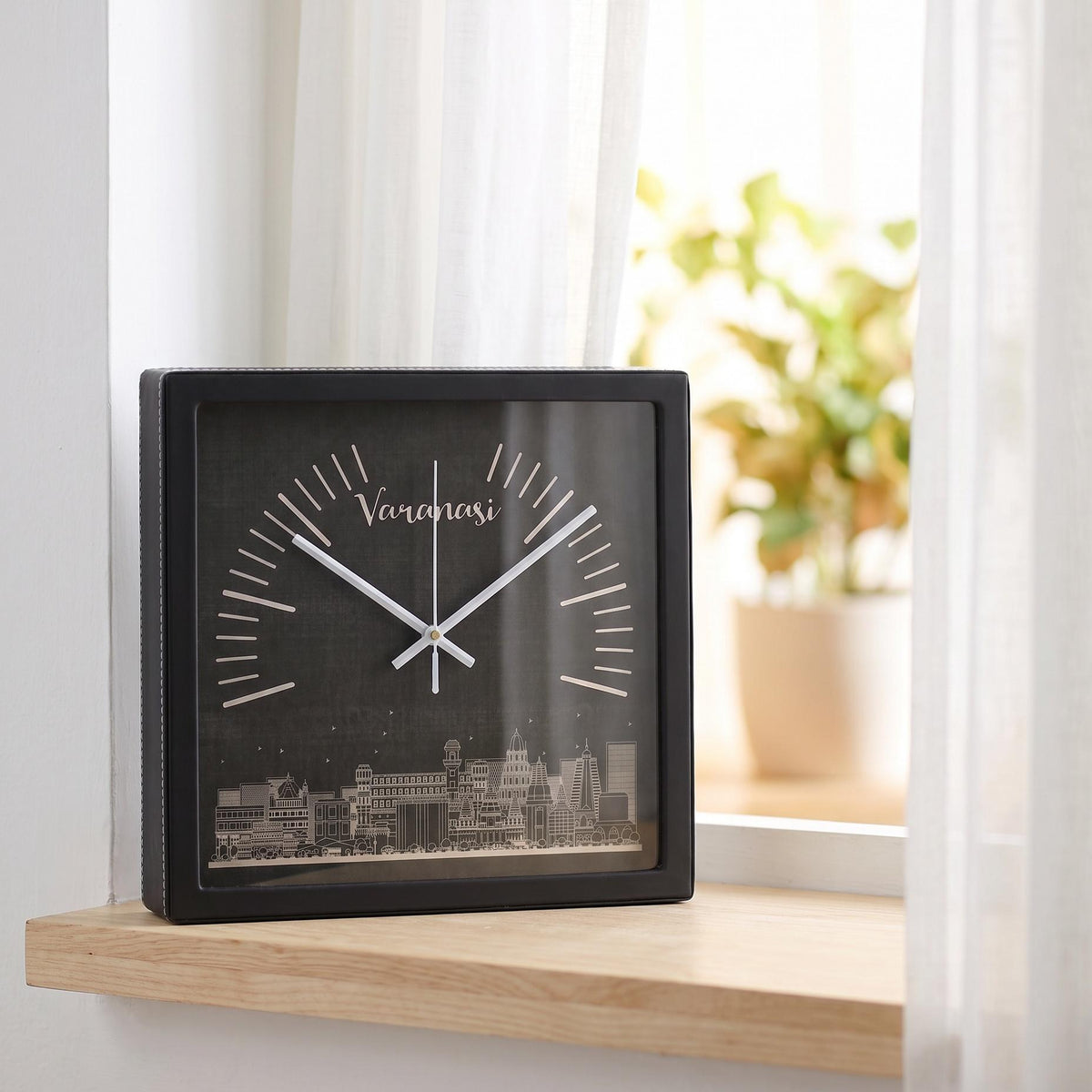 Varanasi skyline wall clock on a hallway wall beside a mirror