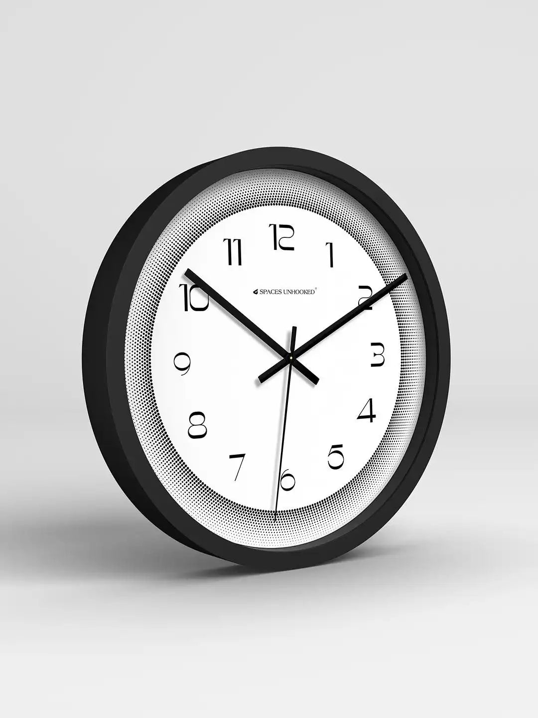 Black and white wall clock on a light gray background