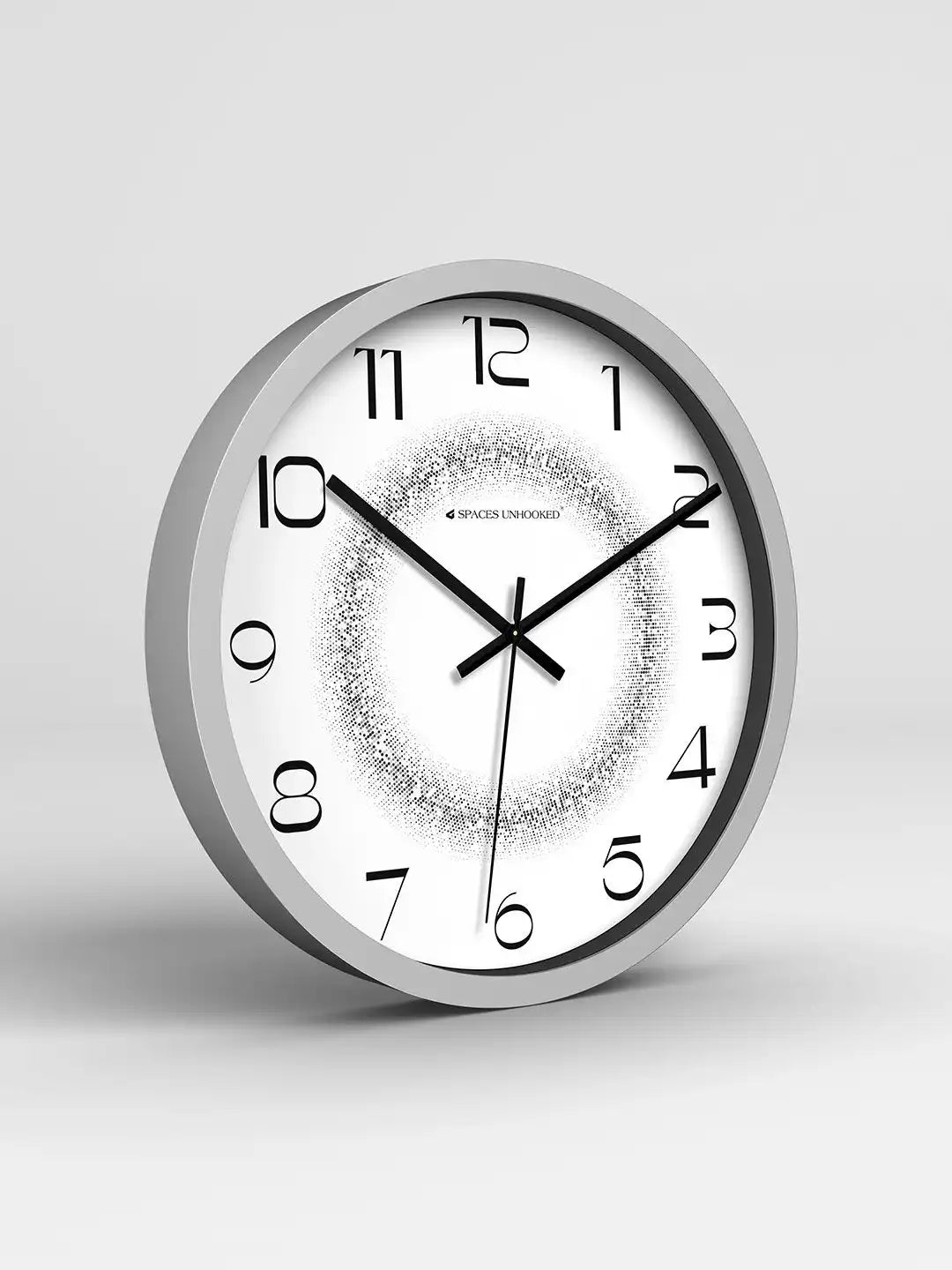 Gray-framed clock with stylized numerals and a halftone-dot gradient center showing 10:11, angled against a plain gray background.