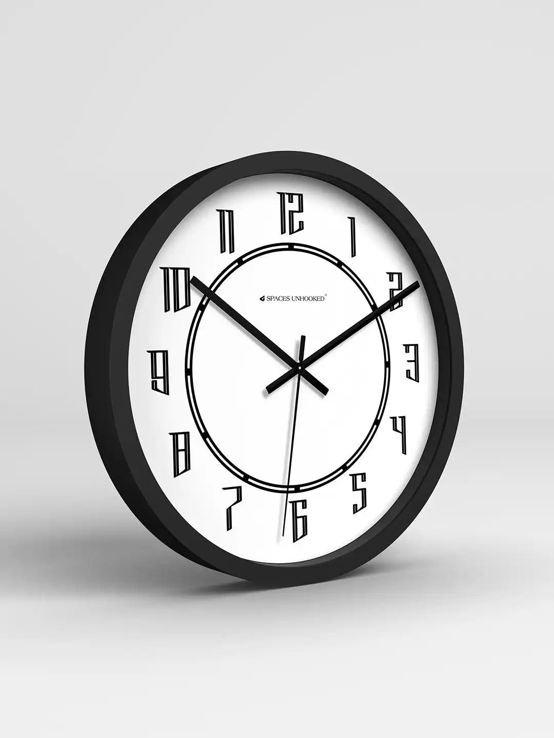 Black and white wall clock on a light gray background