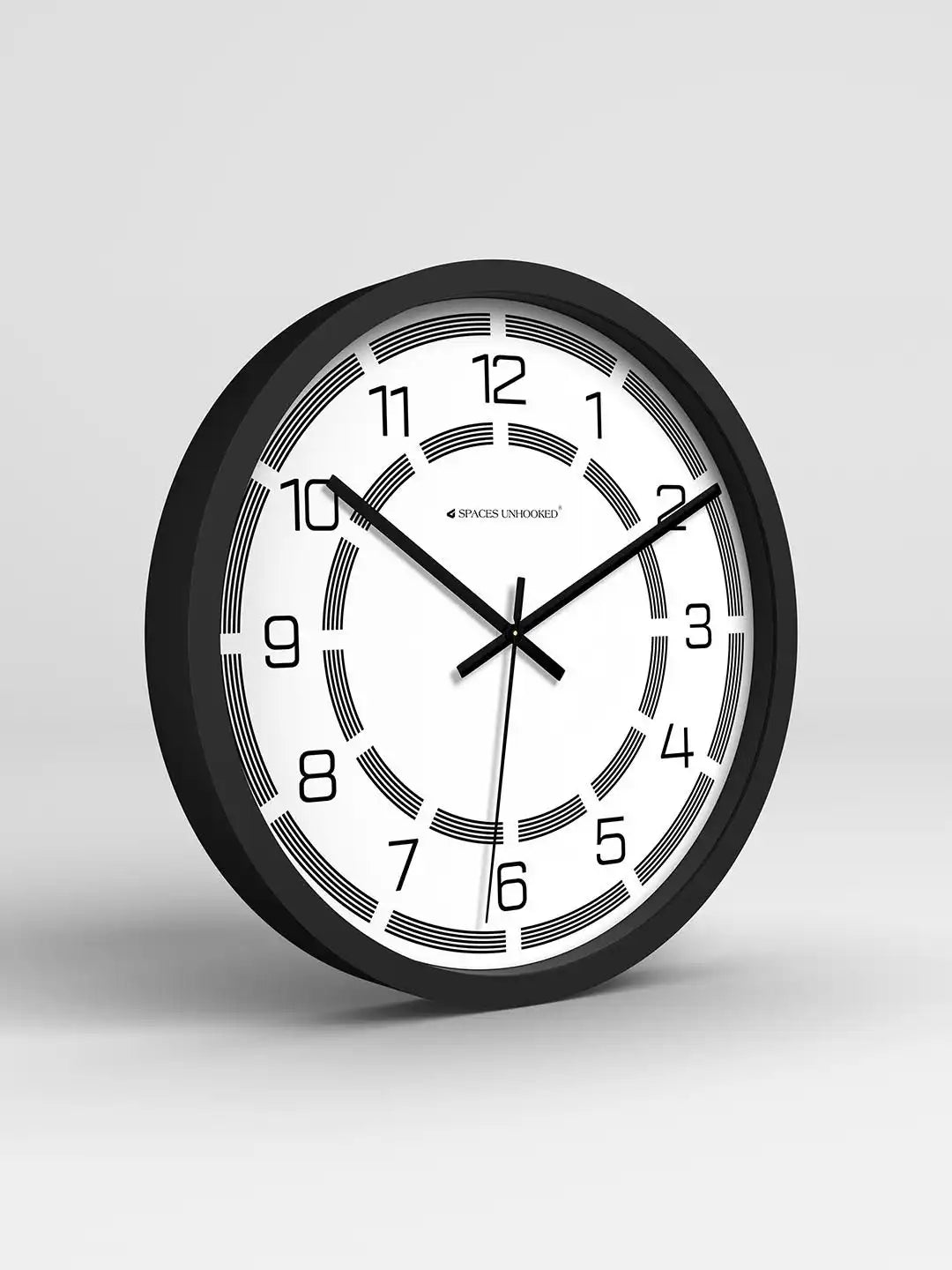 Black and white wall clock on a light gray background