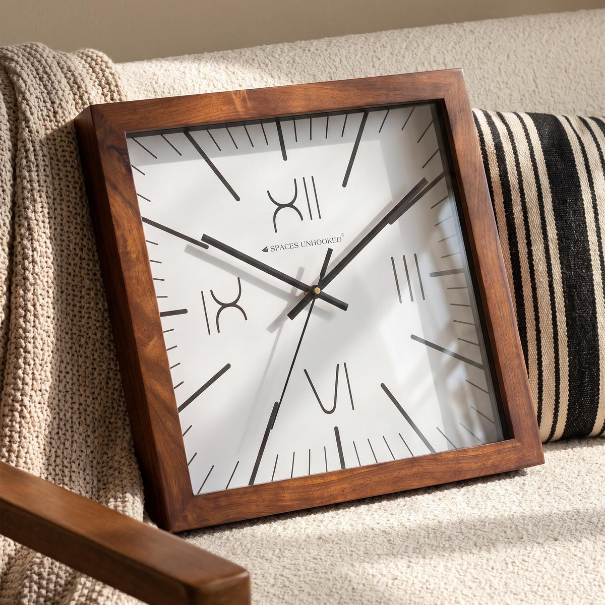 Deep brown square wooden frame with visible grain and clean corners, close-up view