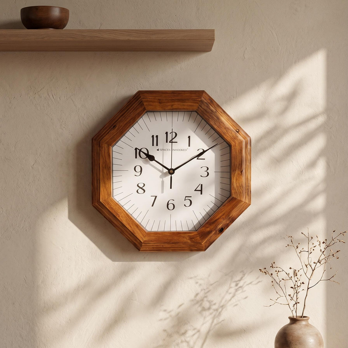 Close-up of the thick bevelled wood-grain frame of an octagonal clock