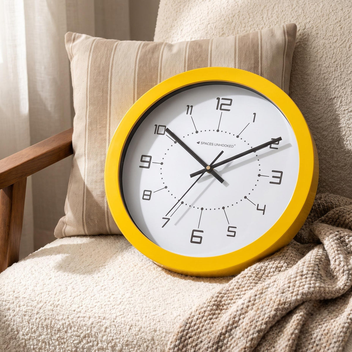 Vivid yellow round frame with a glossy finish around a white dial, close-up view