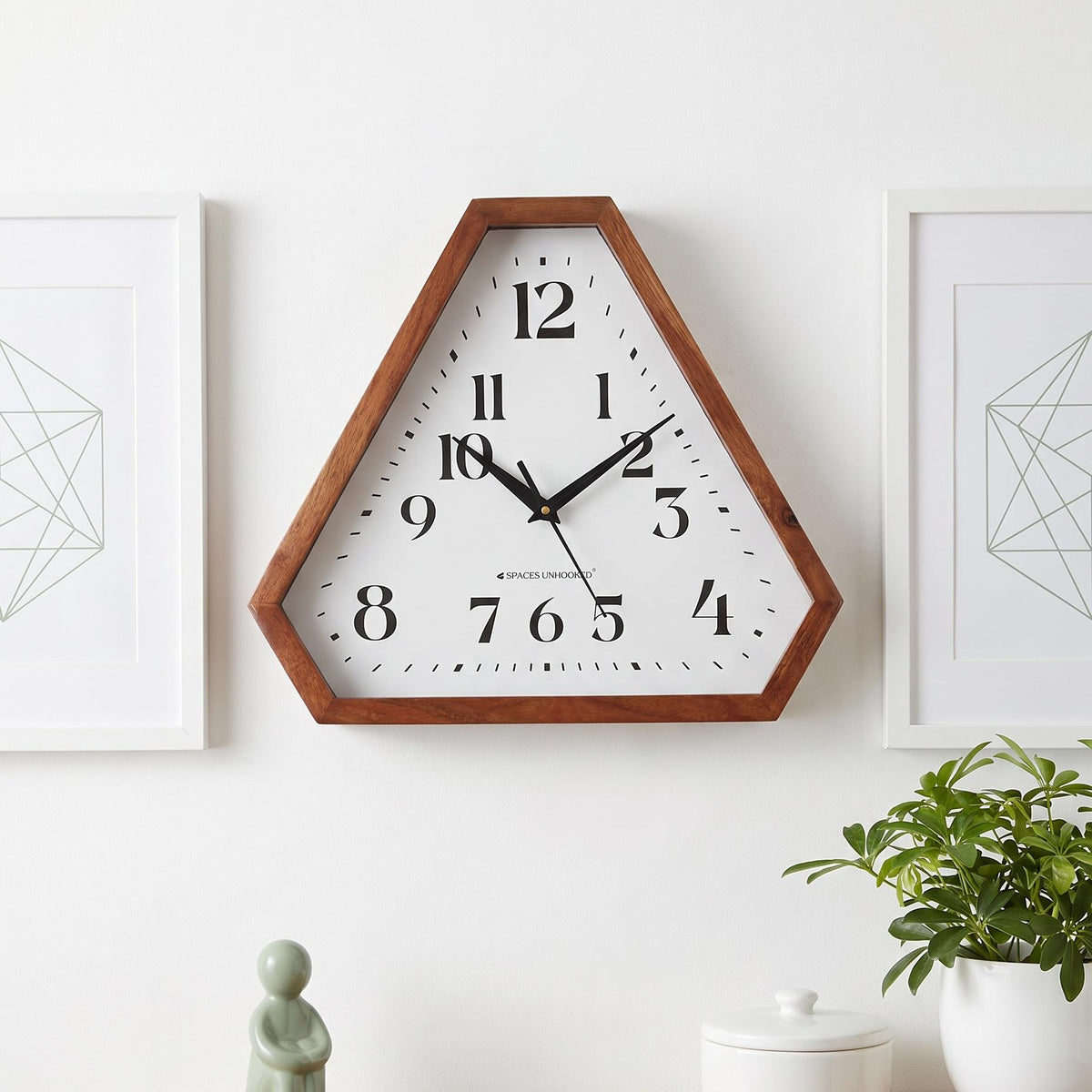 Warm brown triangular wooden frame with visible grain and clipped corners, close-up view